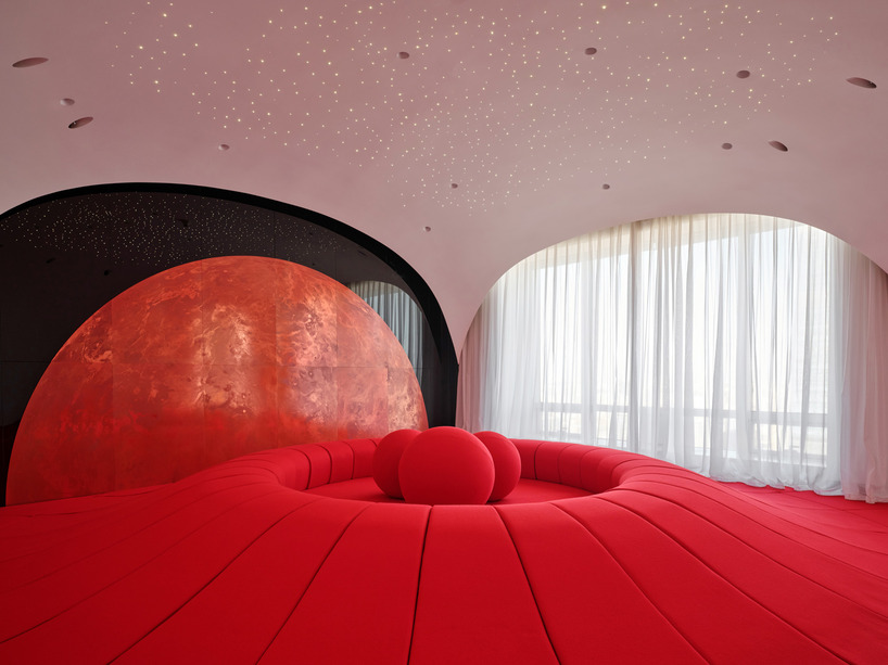 copper planet installation and red undulating seating anchor venus lounge by asap/ in beijing